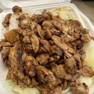 a styrofoam container with meat and vegetables