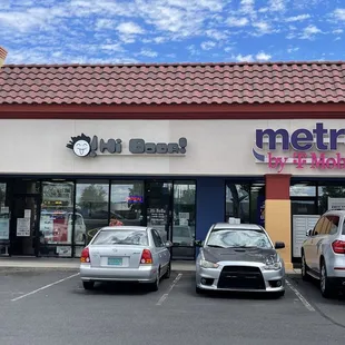 cars parked in front of a restaurant