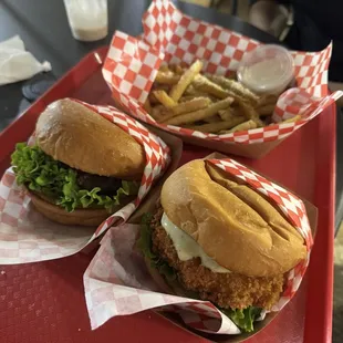 Classic burger, kahuku shrimp burger, not very truffley fries, and a devoured peanut butter shake in the back