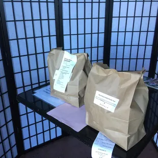 two bags of coffee on a shelf