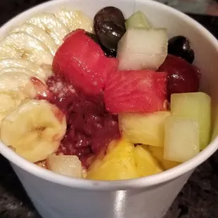 Medium acai bowl with mango and pitaya sorbet. Yum ! $11