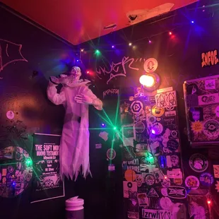 a man dressed as a ghost in a bar