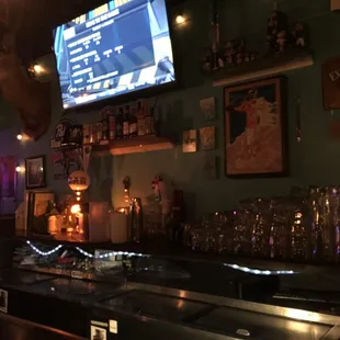 a bar with a large screen tv