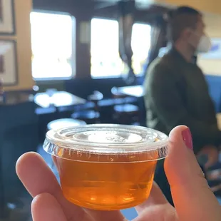 a person holding a cup of tea