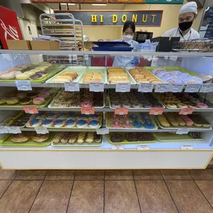 a display case of various donuts