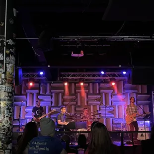 a band performing on stage at a concert