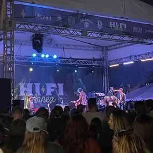 a band performing on stage at a festival