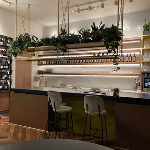 a bar and shelves of wine