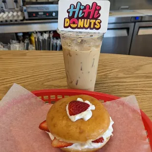 a strawberry cream donut and a drink