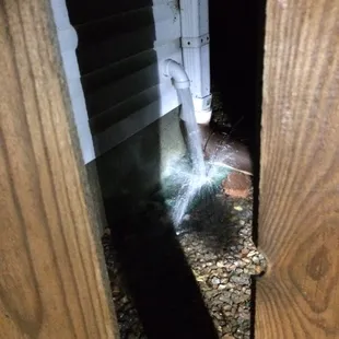 a sprinkle of water coming out of a hole