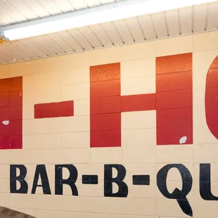 a sign on the wall of a restaurant