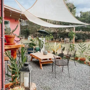 a patio with a table and chairs