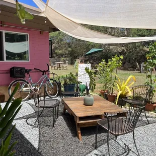 a patio with a table and chairs