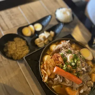 Kimchi hotpot soup, side of instant noodle, fish tofu and eggs