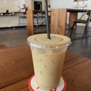 Iced vanilla latte with oat milk