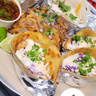 Blackened shrimp tacos, biria tacos, and kalua tacos.