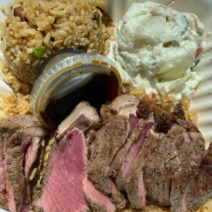 Steak plate with steak fried rice and potato salad