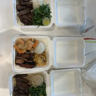 2 steak plates and 1 shrimp bacon combo plate