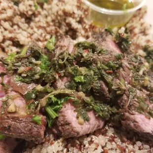 Steak plate with chimichurri sauce on the side