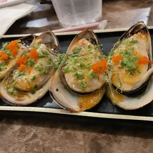 a platter of clams on a table