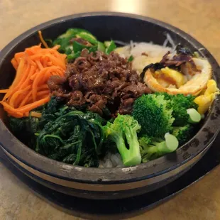 Beef bibimbap. It had a pretty egg on top but I poked it and started mixing it in before I was like "oh, PICTURE DUH"