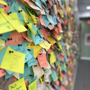 a wall covered with post it notes