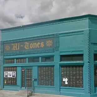 a blue building on a street corner