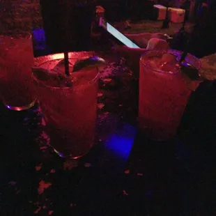 two cocktails on a bar counter