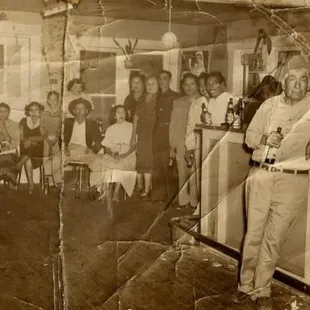 a group of people sitting at a bar