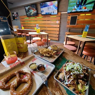 Pretzel, breakfast burrito,  nachos, cocktails