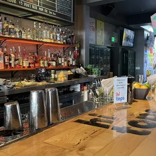 a bar with a lot of bottles of alcohol