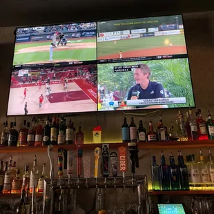 a baseball game being played on tv screens