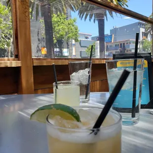 a drink with a lime slice on the rim