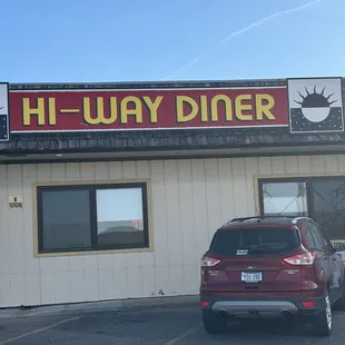 a car parked in front of the restaurant
