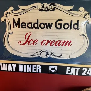 a sign for meadow gold ice cream
