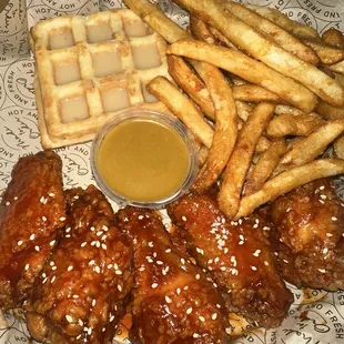 Sweet and Spicy battered wings, waffle, and fries