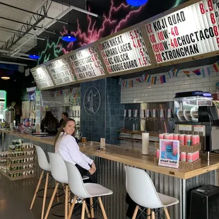 a woman sitting at a bar