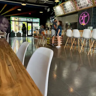 a woman sitting at a bar