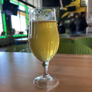 a glass of beer on a table