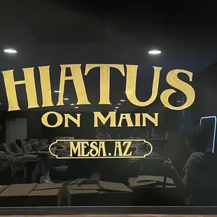 a restaurant with a neon sign