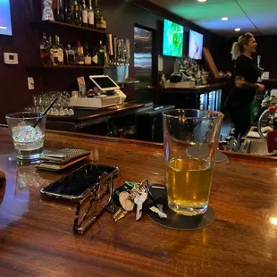 a glass of beer on the bar