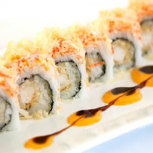 a sushi roll on a white plate