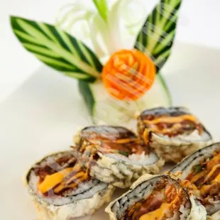 three pieces of sushi on a plate