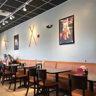 a dining area with tables and chairs