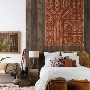 a bedroom with a bed and a chair