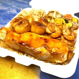 a close up of a meal in a styrofoam container