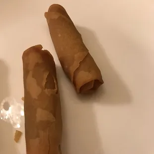 two rolls of food on a plate