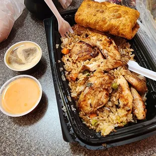 This is my pork egg roll &amp; the chicken fried rice. The yum yum sauce &amp; ginger soy sauce are outstanding!