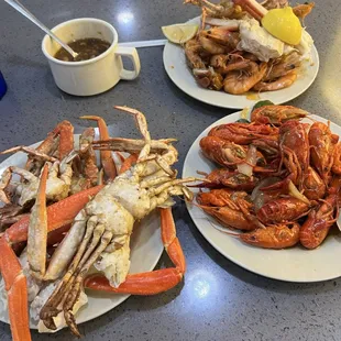 a variety of seafoods on plates