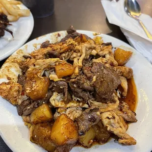 a plate of meat and potatoes